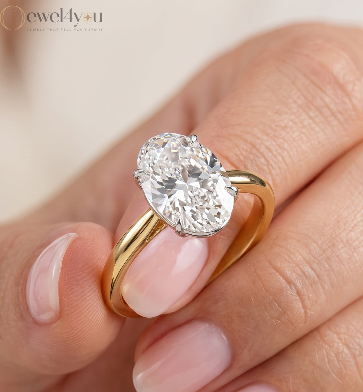 Yellow gold oval diamond solitaire engagement ring with white-gold prong setting #YELLOW GOLD