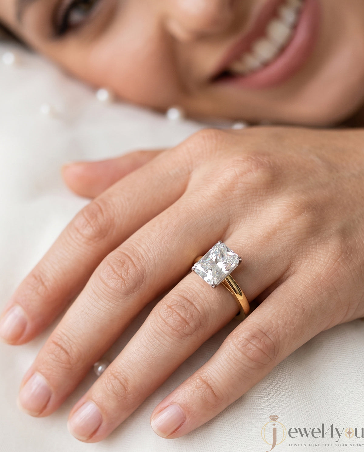 Radiant-cut solitaire ring in yellow gold showing cathedral shoulders and prong setting #YELLOW GOLD
