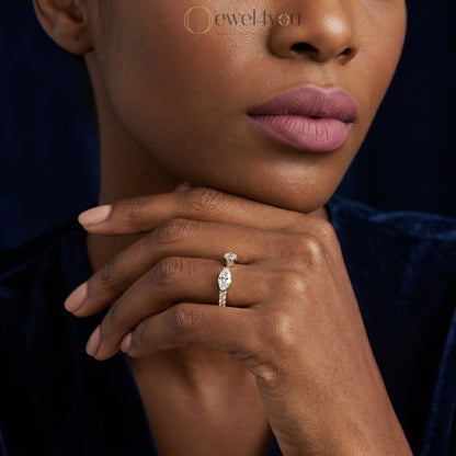 MARQUISE AND ROUND DIAMOND YELLOW GOLD RING 