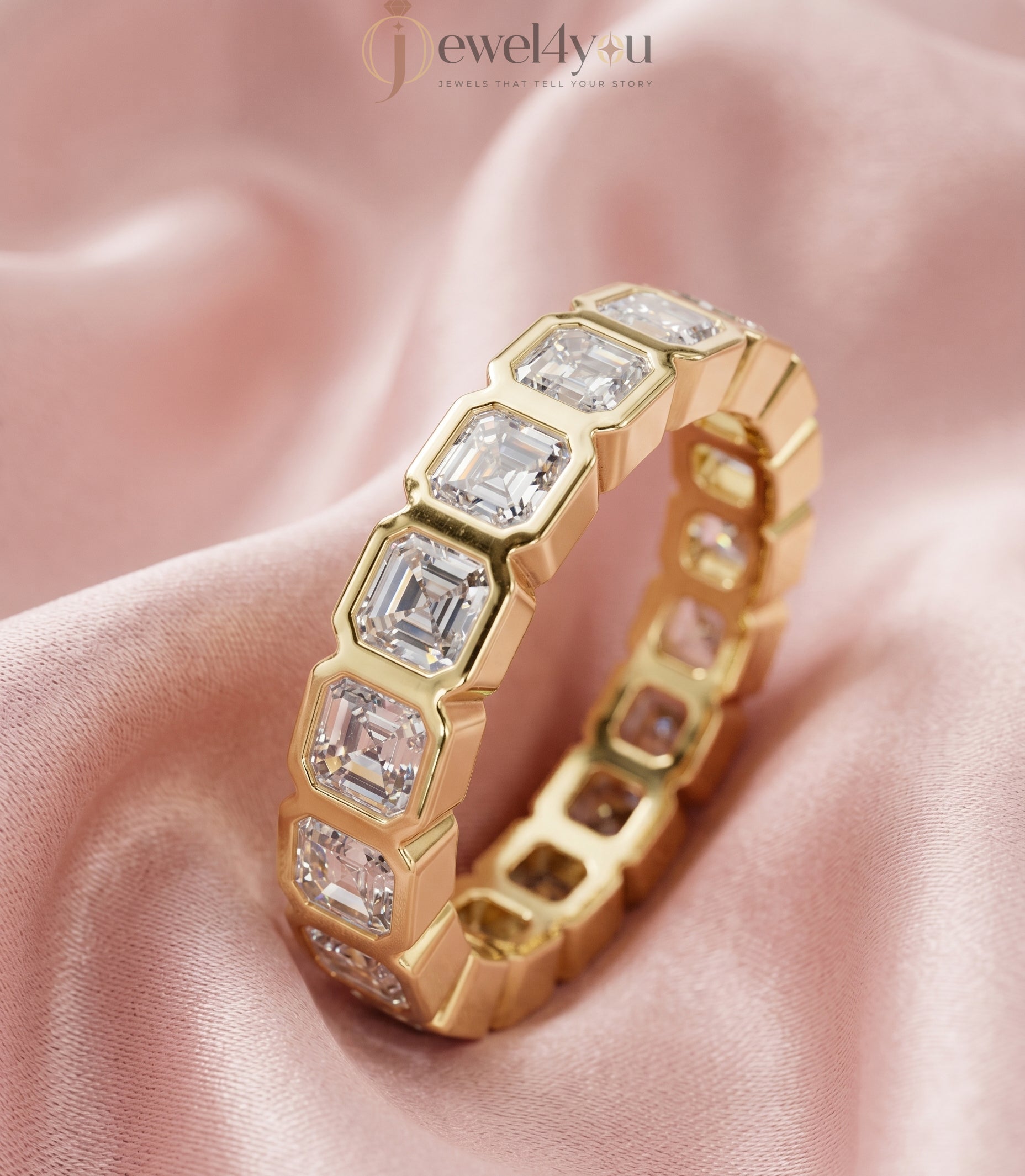 Yellow gold emerald-cut lab-grown diamond eternity band featuring bezel-set VVS to VS+ clarity D–F color diamonds around entire ring #YELLOW GOLD
