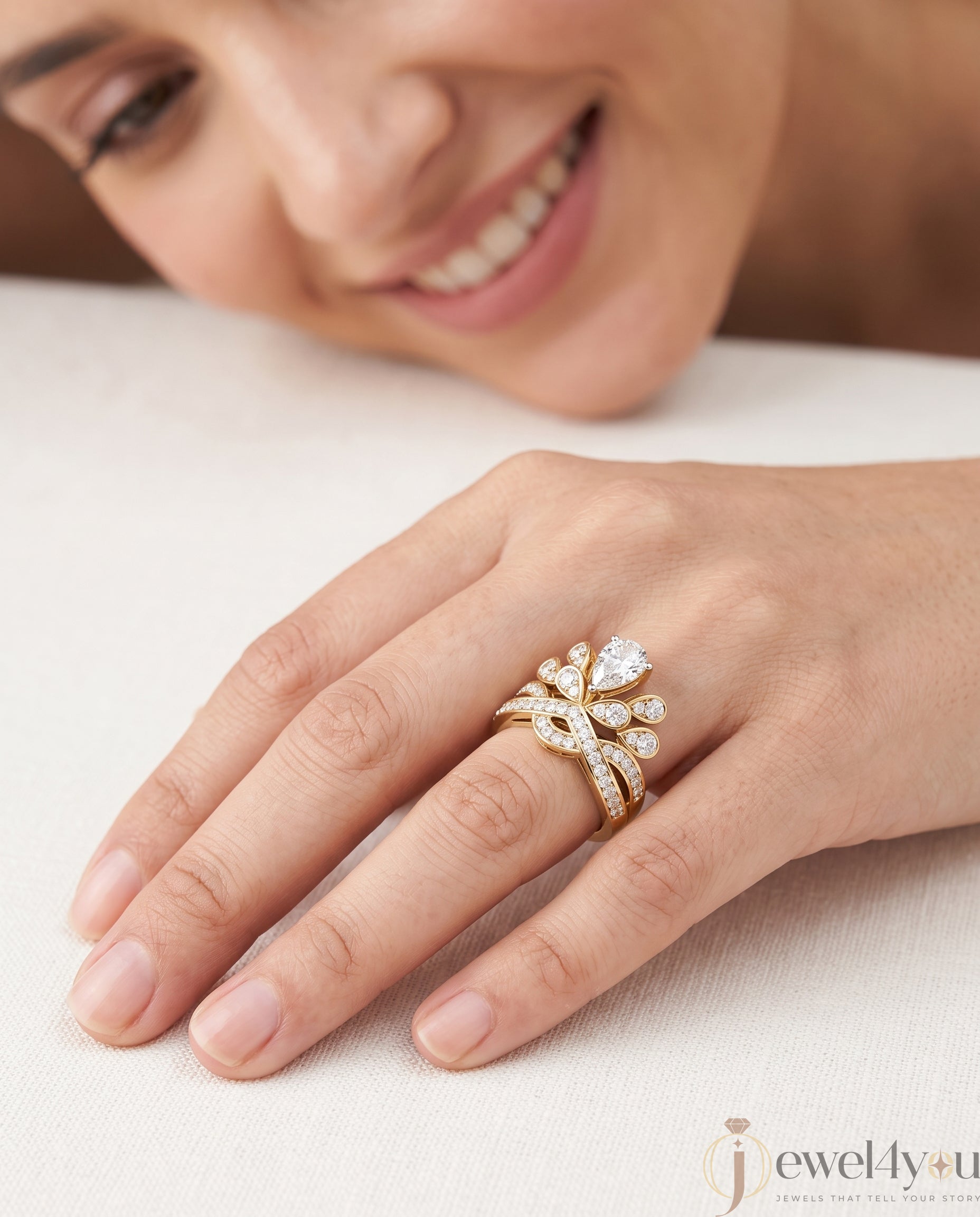 PEAR AND ROUND DIAMOND YELLOW GOLD RING 