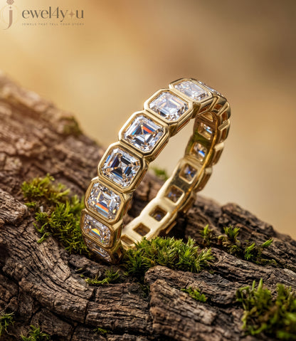 Yellow gold emerald-cut lab-grown diamond eternity band featuring bezel-set VVS to VS+ clarity D–F color diamonds around entire ring #YELLOW GOLD