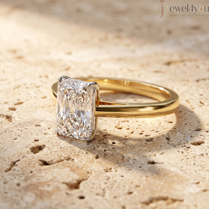 Radiant-cut solitaire ring in yellow gold showing cathedral shoulders and prong setting #YELLOW GOLD
