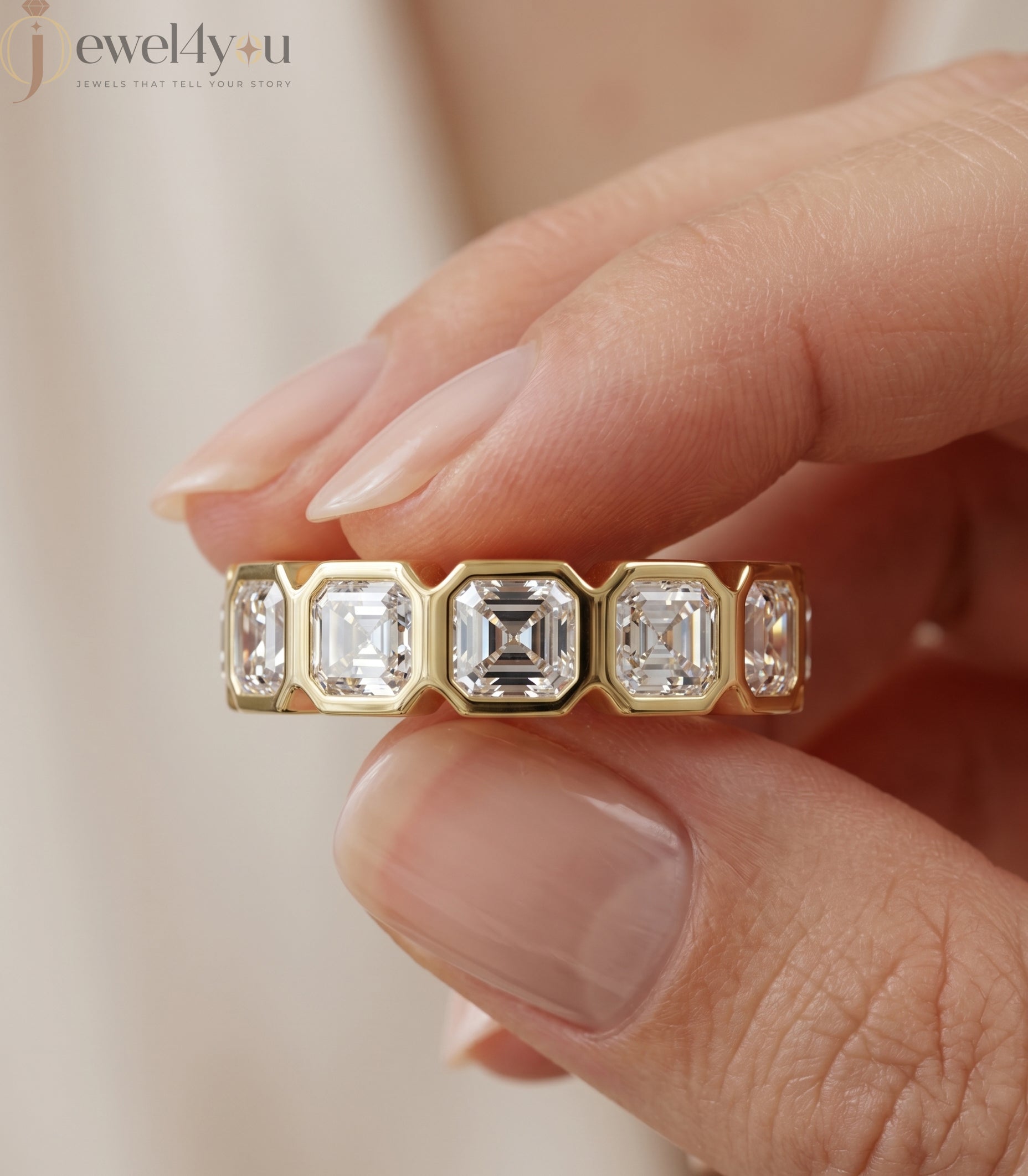 Yellow gold emerald-cut lab-grown diamond eternity band featuring bezel-set VVS to VS+ clarity D–F color diamonds around entire ring #YELLOW GOLD