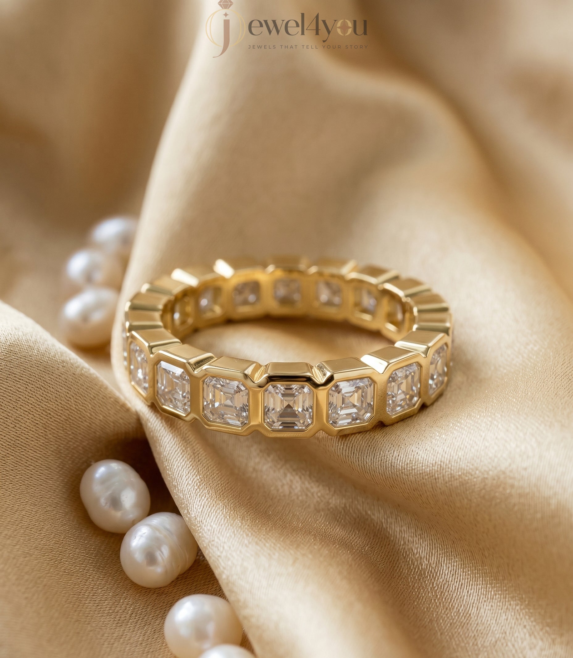 Yellow gold emerald-cut lab-grown diamond eternity band featuring bezel-set VVS to VS+ clarity D–F color diamonds around entire ring #YELLOW GOLD