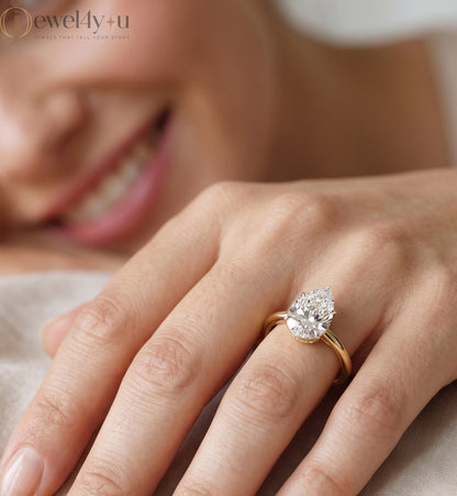 YELLOW GOLD PEAR-CUT LAB DIAMOND ENGAGEMENT RING WITH ELEVATED FOUR-PRONG SETTING 