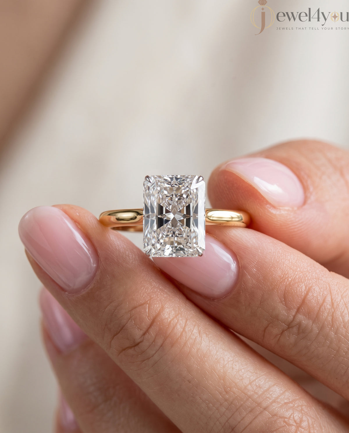 YELLOW GOLD SOLITAIRE ENGAGEMENT RING FEATURING A RADIANT LAB DIAMOND 