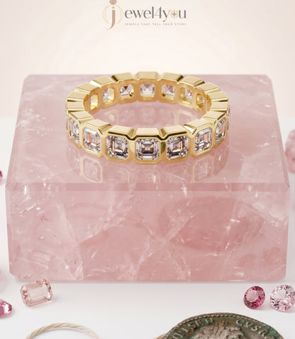 Yellow gold emerald-cut lab-grown diamond eternity band featuring bezel-set VVS to VS+ clarity D–F color diamonds around entire ring #YELLOW GOLD