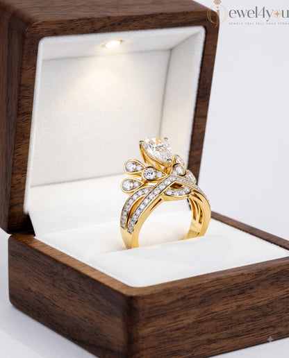 PEAR AND ROUND DIAMOND YELLOW GOLD RING 