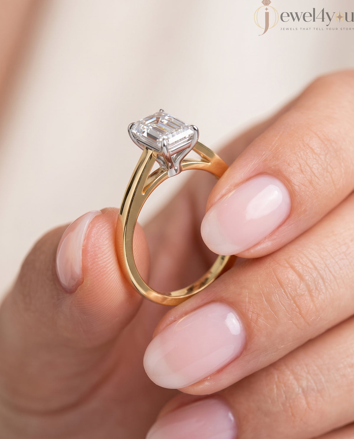 Radiant-cut solitaire ring in yellow gold showing cathedral shoulders and prong setting #YELLOW GOLD