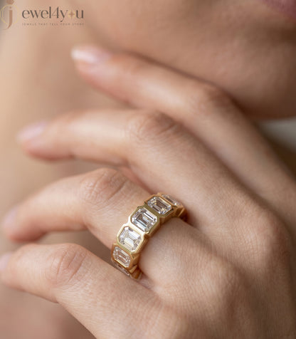 Yellow gold emerald-cut lab-grown diamond eternity band featuring bezel-set VVS to VS+ clarity D–F color diamonds around entire ring #YELLOW GOLD