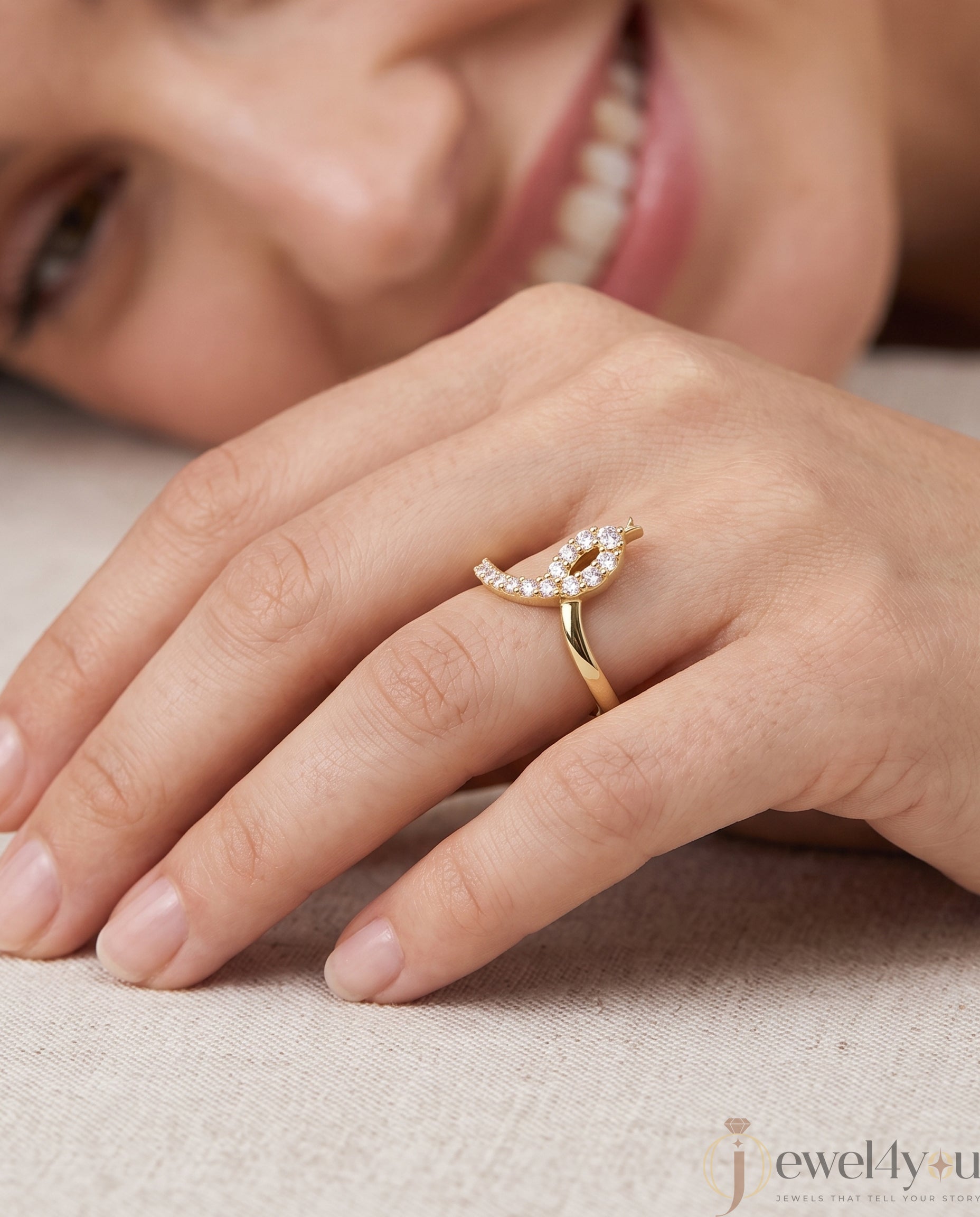 Lab-grown diamond ring front view with open elongated bypass silhouette and round diamonds, VVS to VS+ clarity, D–F color, Yellow Gold prong setting 