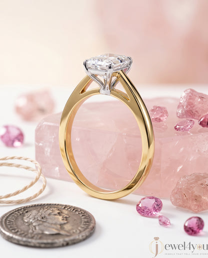 Radiant-cut solitaire ring in yellow gold showing cathedral shoulders and prong setting #YELLOW GOLD