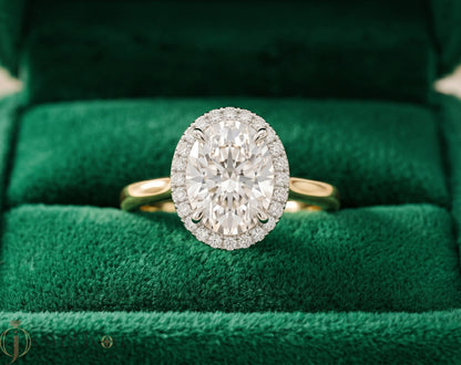 YELLOW GOLD WITH OVAL CENTER AND ROUND HALO 