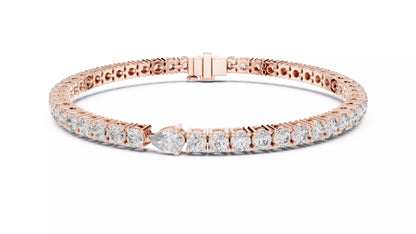 ROSE GOLD LAB-GROWN DIAMOND TENNIS BRACELET SHOWING ARTICULATED PRONG-SET ROUND DIAMONDS AND TEARDROP FOCAL, VVS TO VS+ CLARITY, D–F COLOR #ROSE GOLD