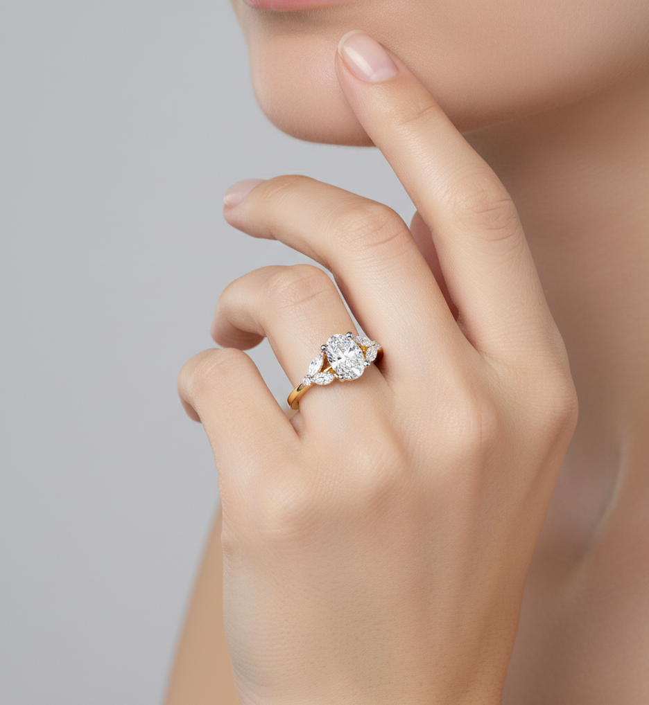 OVAL AND MARQUISE DIAMOND YELLOW GOLD SOLITAIRE RING 