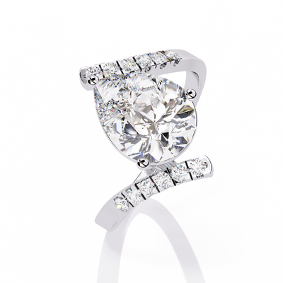 PEAR AND ROUND DIAMOND WHITE GOLD SOLITAIRE RING 