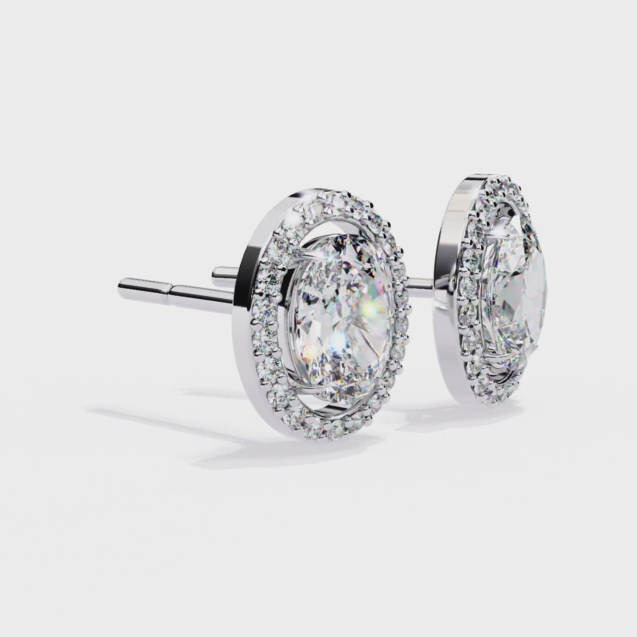 OVAL AND ROUND DIAMOND WHITE GOLD SOLITAIRE HALO STUD ##WHITE GOLD